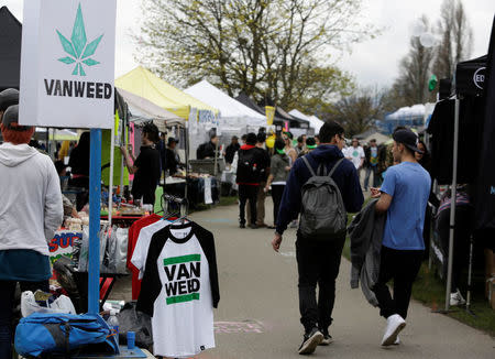 People walk among various vendor tents at the annual 4/20 marijuana event at Sunset Beach in Vancouver, British Columbia, Canada April 20, 2017. REUTERS/Jason Redmond