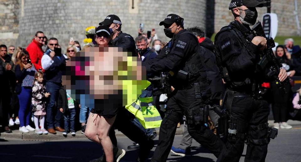 The topless woman was deatined. (Reuters)