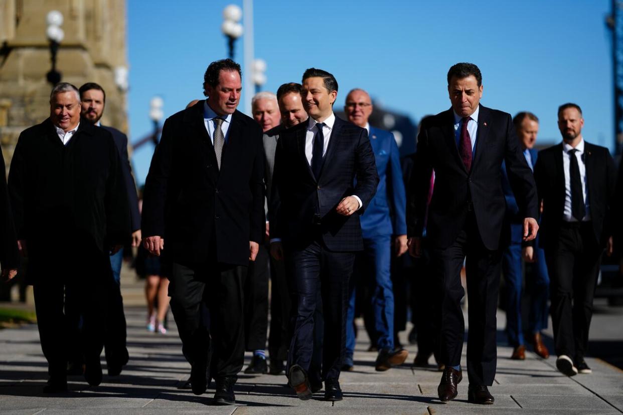 Conservative Leader Pierre Poilievre, centre, walks with members of his caucus after a news conference on Parliament Hill in Ottawa on April 16, 2024. (Sean Kilpatrick/The Canadian Press - image credit)