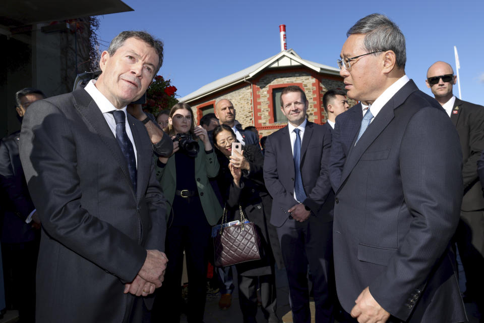 Chinese Premier Li Qiang, front right, talks with Penfolds winemaker Peter Gago, left, at Magill Estate winery in Adelaide, Australia, Sunday, June 16, 2024. (AP Photo/Kelly Barnes, Pool)