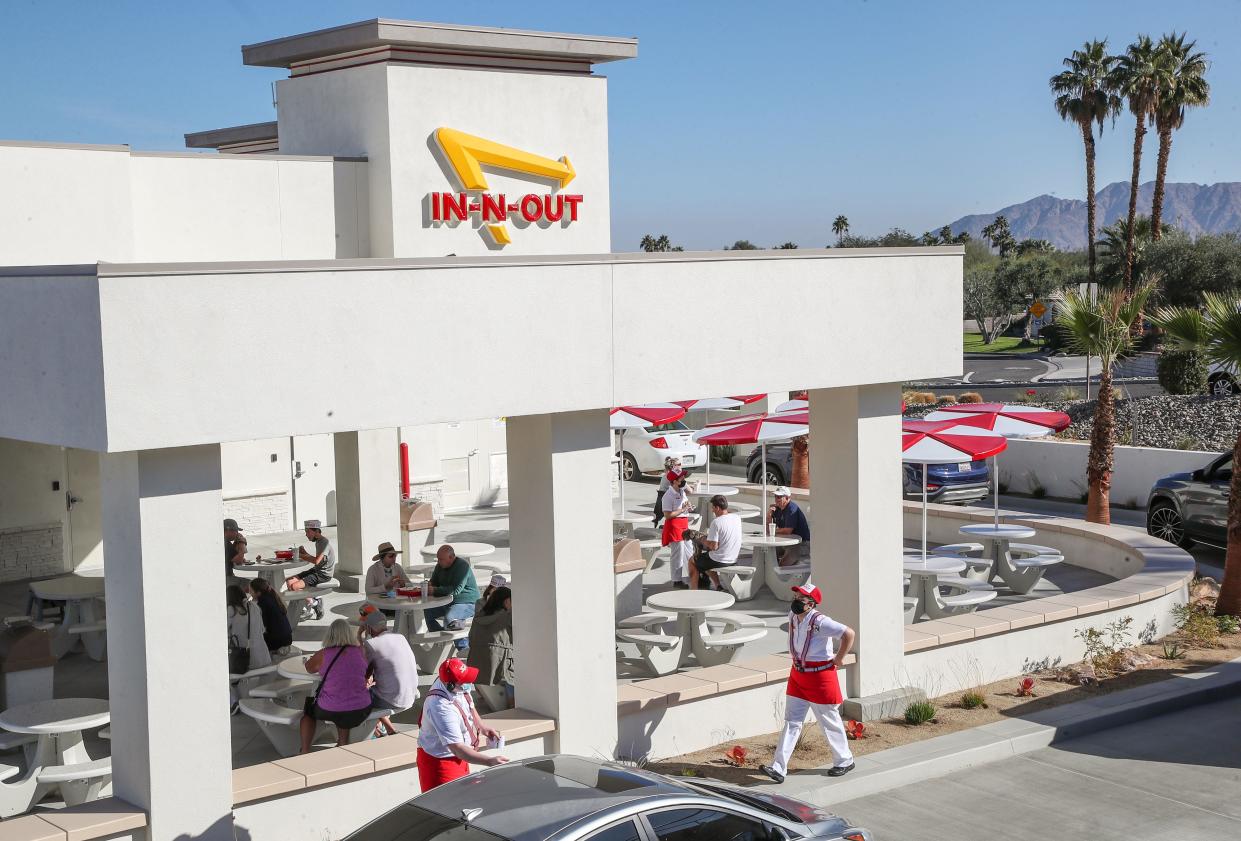 Customers wait in their cars in the drive thru line at the new In-N-Out in Rancho Mirage, January 7, 2022.