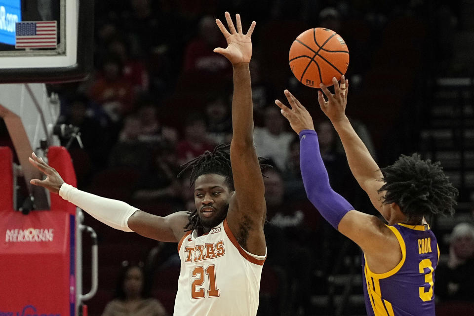 Texas forward Ze'Rik Onyema (21) pressures LSU guard Jalen Cook (3) during the first half of an NCAA college basketball game, Saturday, Dec. 16, 2023, in Houston. (AP Photo/Kevin M. Cox)