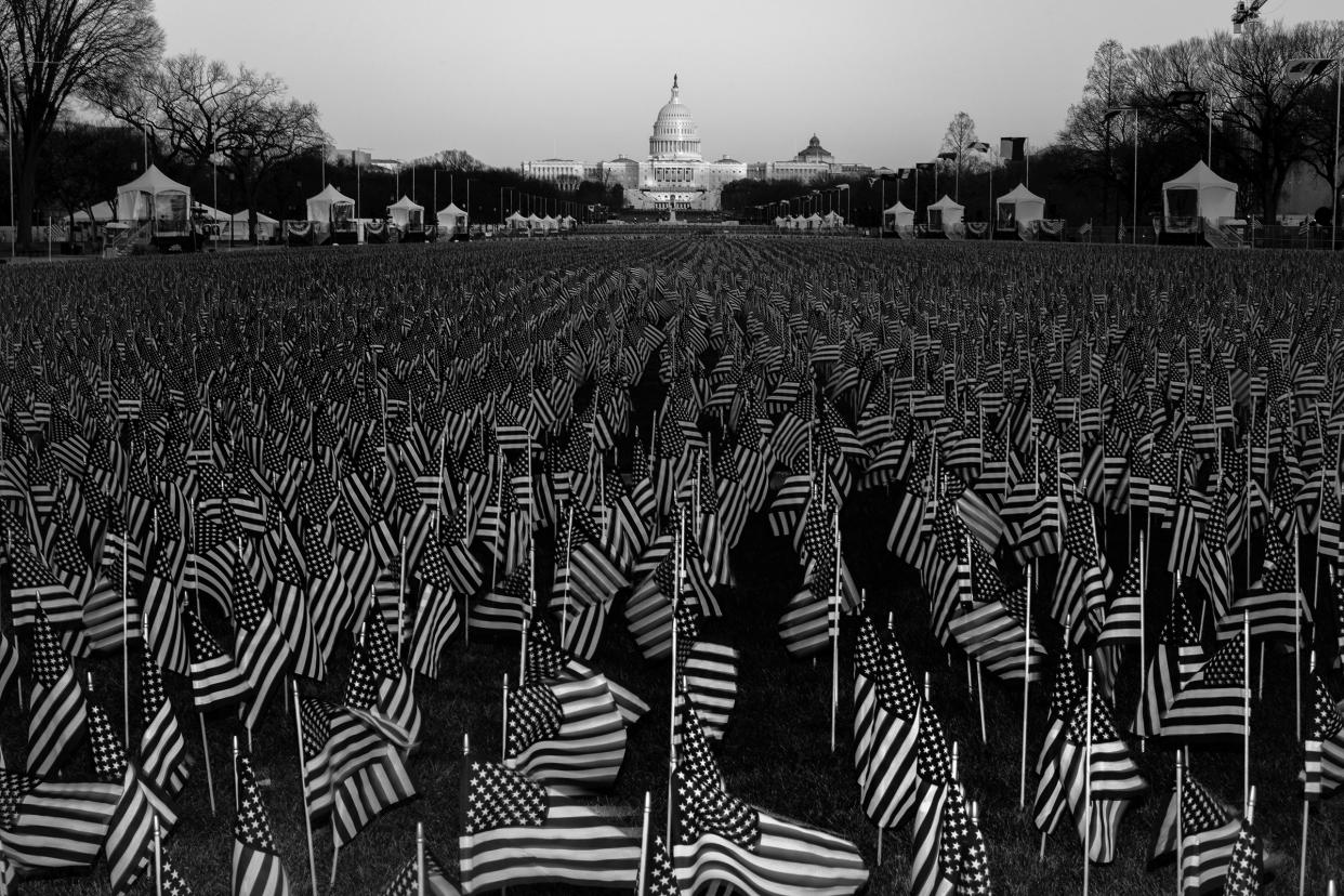 A field of flags on the National Mall in Washington, D.C., on Jan. 19, one day before the inauguration of President-elect Joe Biden and Vice President-elect Kamala Harris. The public art display features nearly 200,000 flags, representing Americans who would have gathered for the inauguration, according to the organizing committee.