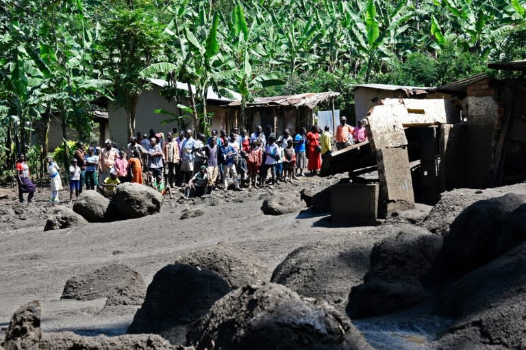 Huge boulders, some as large as cars or houses, litter Wajenwa village after Uganda's Sume river burst its banks