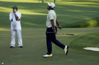 Hideki Matsuyama, of Japan, reacts after missing a putt on the 16th hole during the final round of the Masters golf tournament on Sunday, April 11, 2021, in Augusta, Ga. (AP Photo/Gregory Bull)