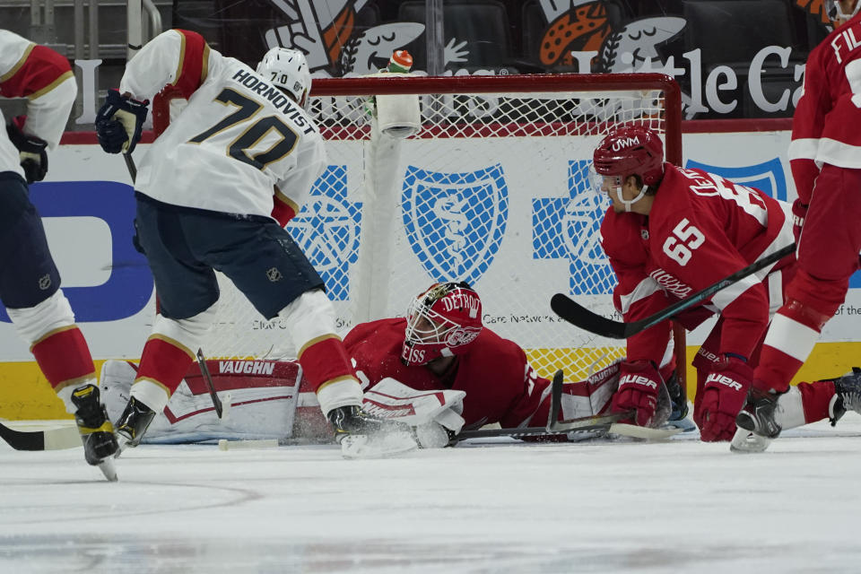 Florida Panthers right wing Patric Hornqvist (70) scores on Detroit Red Wings goaltender Thomas Greiss (29) in the second period of an NHL hockey game Sunday, Jan. 31, 2021, in Detroit. (AP Photo/Paul Sancya)