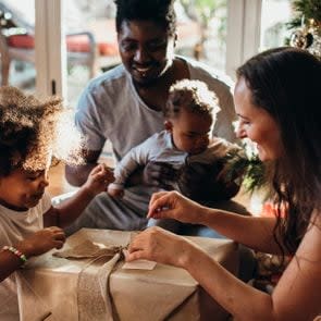 family opening presents on christmas morning