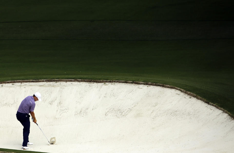 FILE - Jordan Spieth hits out of a bunker on the eighth hole during the second round of the Masters golf tournament Friday, April 10, 2015, in Augusta, Ga. Spieth says this bunker is his least favorite place to be. (AP Photo/David J. Phillip, File)