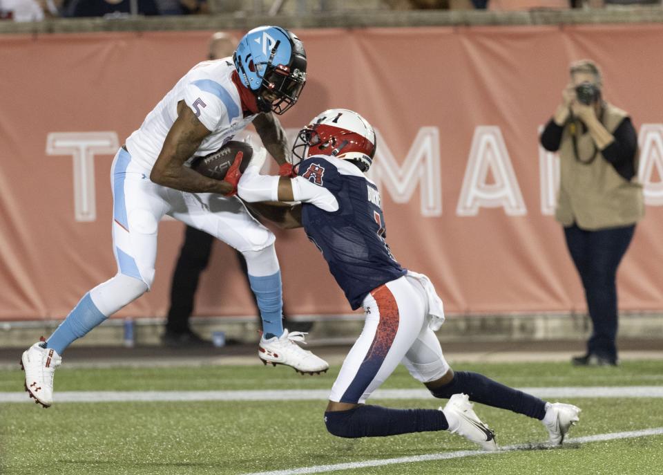 Feb 26, 2023; Houston, TX, USA; Arlington Renegades defensive back Will Hill (5) breaks the tackle of Houston Roughnecks wide receiver Deontay Burnett (1) after intercepting the ball in the fourth quarter at TDECU Stadium. Mandatory Credit: Thomas Shea-USA TODAY Sports