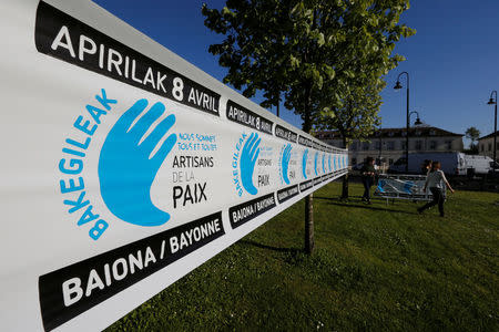 Youths prepare a banner on the eve of a demonstration to mark the handover of arms and explosives by civilian middlemen collected from the Basque militant separatist group ETA, in Bayonne, France, April 7, 2017. Banner reads, "Artisans of Peace". REUTERS/Regis Duvignau