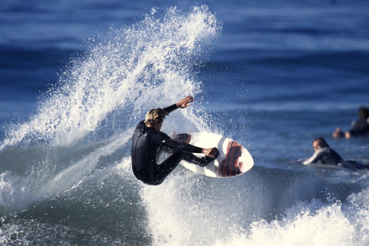 surfer riding a wave in the ocean of Malibu