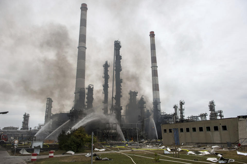 Some rises over the area of a Bayernoil refinery in Vohburg an der Donau near Ingolstadt, southern Germany, Saturday, Sept. 1, 2018 after a fire broke out. (Lino Mirgeler/dpa via AP)