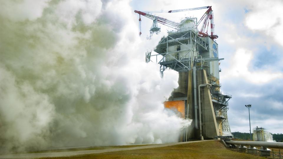 test stand showing a lot of smoke and a fiery interior during an engine test