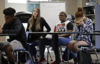 In this photo taken Tuesday, May 21, 2019, 11th grade students learn about the D-Day invasion at Normandy during an advanced placement history class at Crossroads FLEX school in Cary, N.C. Its 75th anniversary brings extra classroom attention to D-Day, which has waned as a topic that’s emphasized in schools across the world. In a North Carolina classroom, students learn about spies, the deadly military practice before D-Day and a general who kept his plans "on the down low." (AP Photo/Gerry Broome)