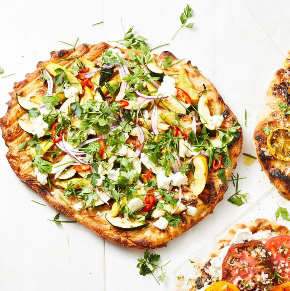 <p>This summer stunner topped with zucchini, yellow squash, fresh herbs and goat cheese goes with anything.</p><p>Get the <a href="https://www.goodhousekeeping.com/food-recipes/a36256013/summer-squash-pizza-recipe/" rel="nofollow noopener" target="_blank" data-ylk="slk:Summer Squash Pizza recipe;elm:context_link;itc:0;sec:content-canvas" class="link "><strong>Summer Squash Pizza recipe</strong></a><em>.</em></p>