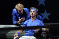 Team Europe's Alexander Zverev, of Germany, left, speaks to teammate Andrey Rublev, of Russia, during a break in his match against Team World's Diego Schwartzman, of Argentina, at Laver Cup tennis, Friday, Sept. 24, 2021, in Boston. (AP Photo/Elise Amendola)