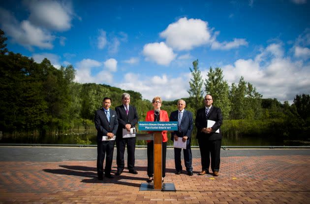 Former Ontario minister Steven Del Duca stands with then-premier Kathleen Wynne at a climate announcement in Toronto on June 8, 2016.