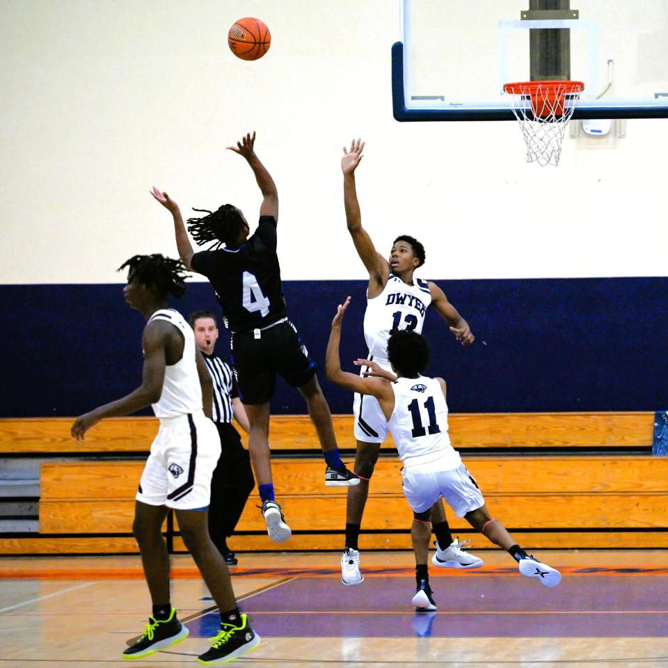 Park Vista's Tray Goldwire (4) goes up for a rebound against Dwyer on Dec. 28, 2023.