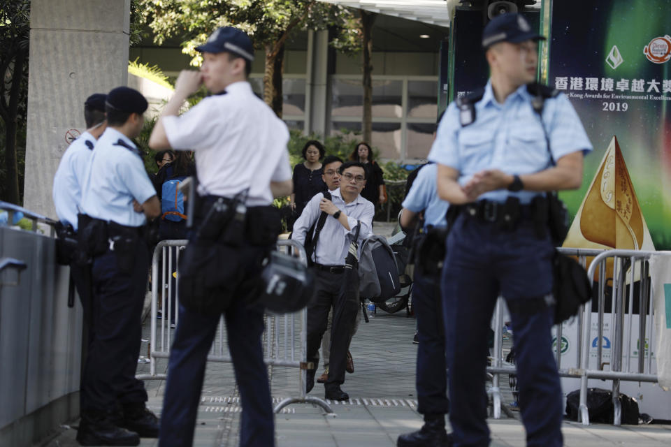 Police officers man a check point into the Legislative Council in Hong Kong on Friday, June 14, 2019. Calm appeared to have returned to Hong Kong after days of protests by students and human rights activists opposed to a bill that would allow suspects to be tried in mainland Chinese courts. (AP Photo/Vincent Yu)