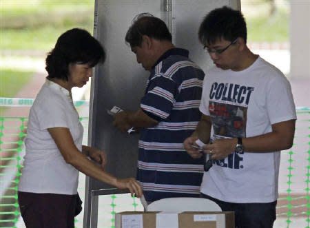 Singaporeans casting their votes on 7 May 2011. (Reuters)