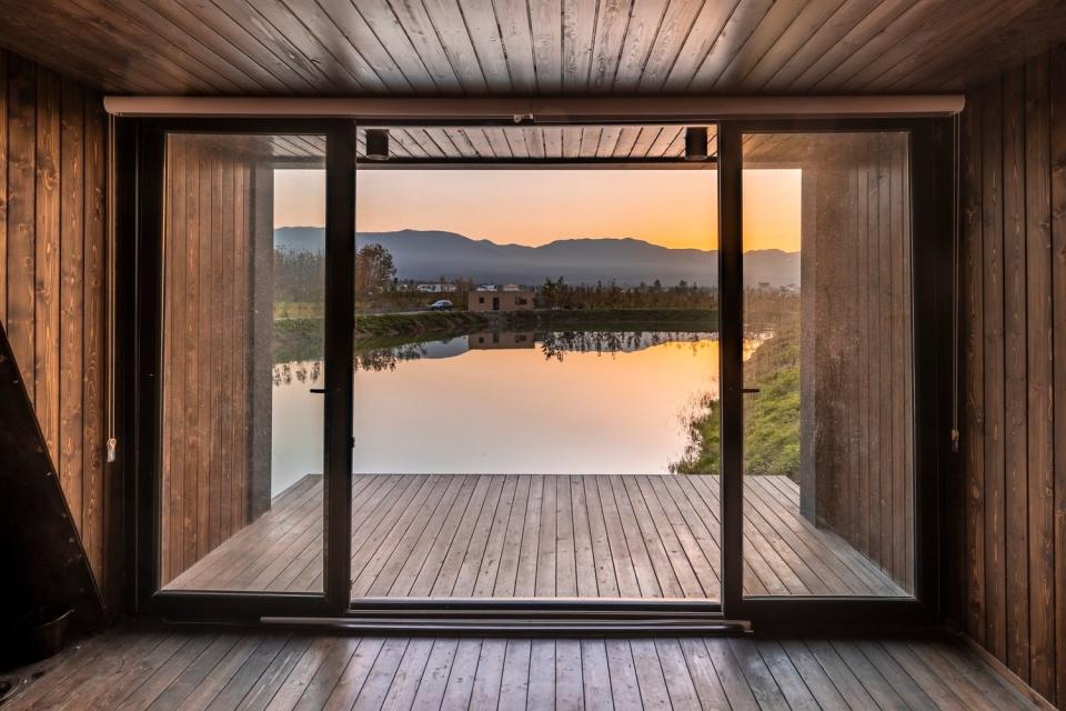 View out over the water from the Wicker House's box-like terrace attachment.