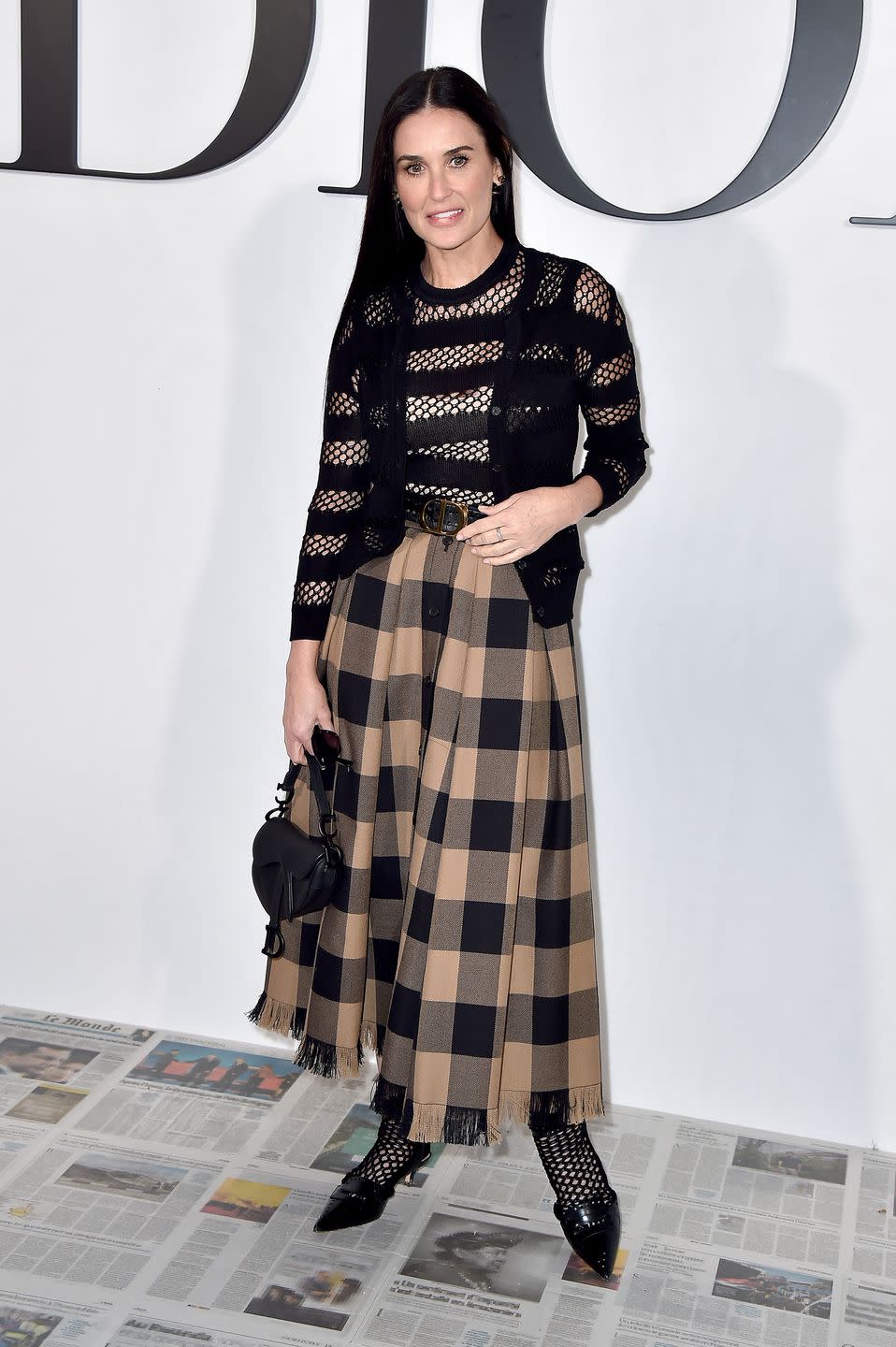 <p>Demi Moore accessorised her Dior outfit with the iconic saddle bag. </p>