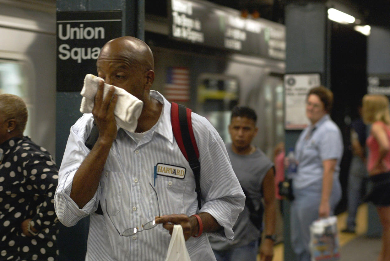 A passenger in a subway station in New York City on Aug. 5, 2005, when the high was 95 degrees Fahrenheit.