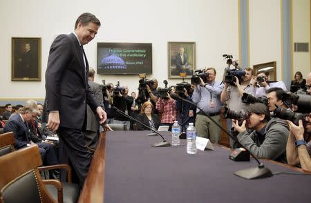 FBI Director James Comey arrives for a House Judiciary hearing on "The Encryption Tightrope: Balancing Americans' Security and Privacy" on Capitol Hill in Washington March 1, 2016. REUTERS/Joshua Roberts