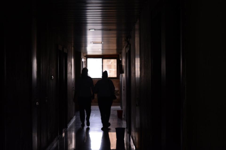 Students walking in the hostel corridors (Namita Singh/The Independent)