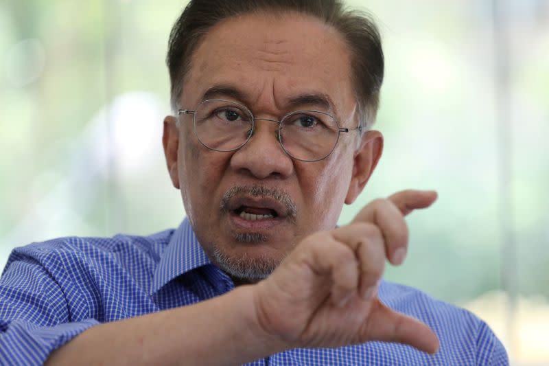 FILE PHOTO: Malaysian politician Anwar Ibrahim speaks during an interview with Reuters in Petaling Jaya