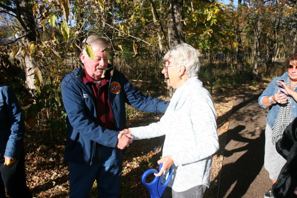 Tennessee Lt. Gov. Randy McNally greets Louise Collier, who with her late husband donated the land for Collier Preserve, during the dedication of the Storybook Trail.