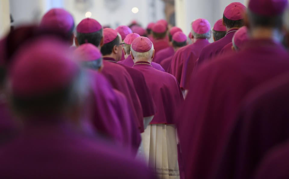 Bishops attend the opening mass of the German bishops' conference in Fulda, Germany, Tuesday, Sept. 25, 2018 where the bishops will discuss a study on sexual abuse in the Catholic church in Germany. (Arne Dedert/dpa via AP)