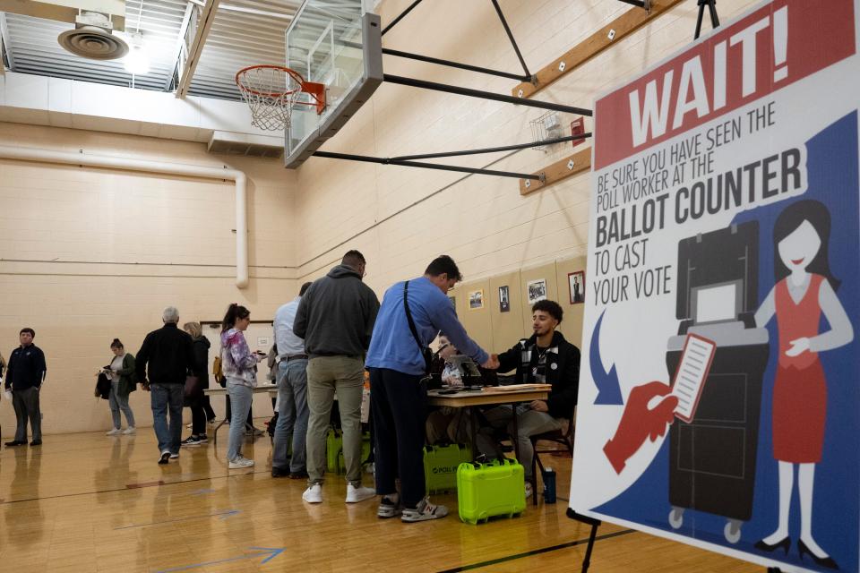 Nov 8, 2022; Columbus, OH, United States;  Voters stand in line to vote at the Annunciation Greek Orthodox Cathedral during midterm elections on Tuesday night. Mandatory Credit: Joseph Scheller-The Columbus Dispatch