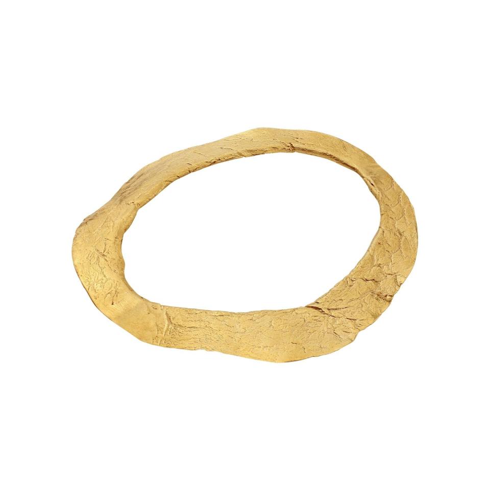 <p>Made from 100 per cent recycled precious metal with a handmade finish, this wonderful pendant has an ancient, love-worn feel. Its design is inspired by tales of Celtic voyages. </p><p>Gold bangle, £180, Lylie's</p><p><a class="link " href="https://lylies.com/collections/all/products/the-iverni-celtic-bangle?variant=52061706436" rel="nofollow noopener" target="_blank" data-ylk="slk:SHOP NOW;elm:context_link;itc:0;sec:content-canvas">SHOP NOW</a></p>