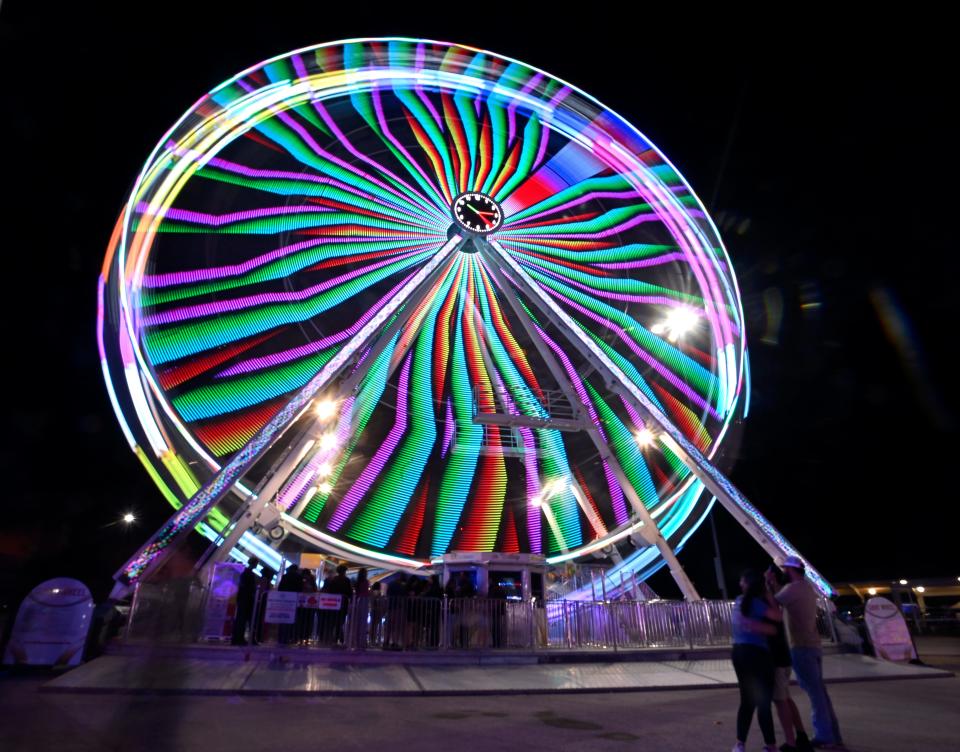 The lights of the carnival ferris wheel are blurred in this long exposure outside the San Angelo Rodeo Saturday.