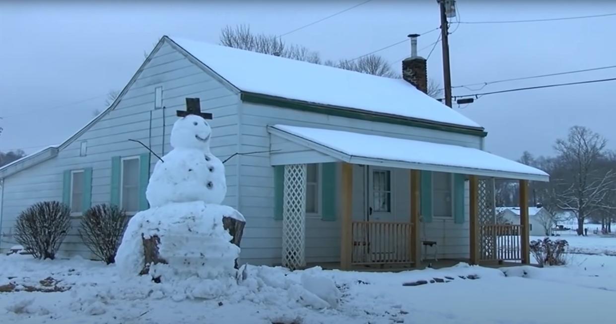 A driver tried to run over Kentucky snowman which had tree trunk has base.