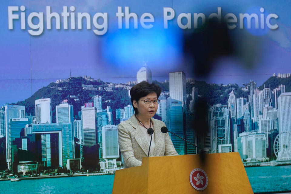 Hong Kong Chief Executive Carrie Lam listens to reporters' questions during a press conference in Hong Kong, Tuesday, May 4, 2021. Lam said on Tuesday that the government has not decided on compulsory vaccination requirement for foreign domestic workers. (AP Photo/Vincent Yu)