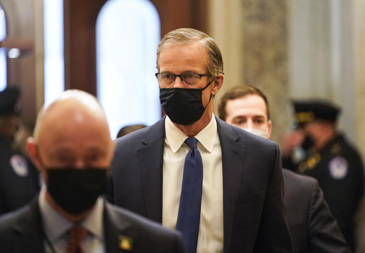 Senator John Thune, a Republican from South Dakota, arrives at the U.S. Capitol in Washington, D.C., U.S., on Wednesday, Feb. 10, 2021. (Joshua Roberts/Reuters/Bloomberg via Getty Images)