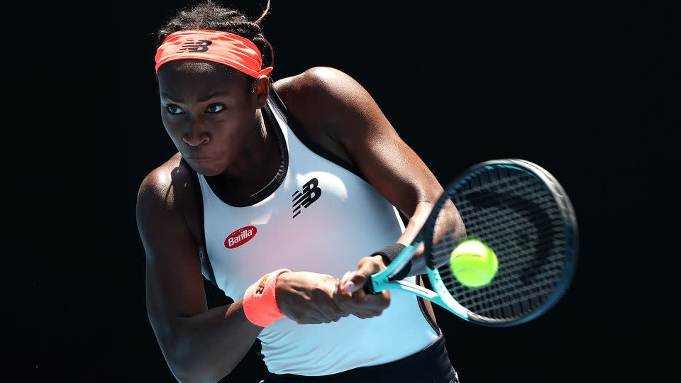 Gauff plays a backhand during singles match against Jelena Ostapenko during the fourth round of the 2023 Australian Open. - Cameron Spencer/Getty Images