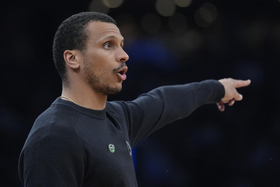 Boston Celtics head coach Joe Mazzulla shouts to his players in the first half of an NBA basketball game against the Washington Wizards, Sunday, April 14, 2024, in Boston. (AP Photo/Steven Senne)