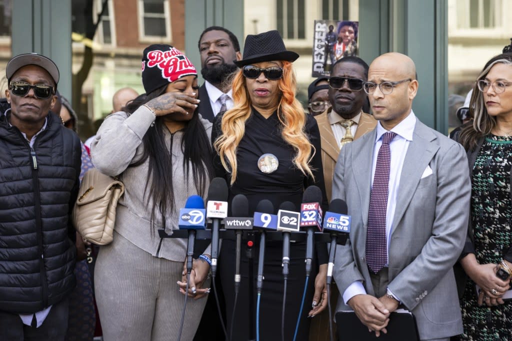 Flanked by family members, attorneys and supporters, Dexter Reed’s mother, Nicole Banks, speaks to reporters outside the headquarters for the Civilian Office of Police Accountability in West Town, Chicago, April 9, 2024. (Ashlee Rezin /Chicago Sun-Times via AP, file)