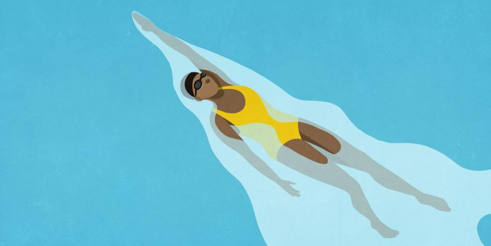 woman swimming backstroke in water