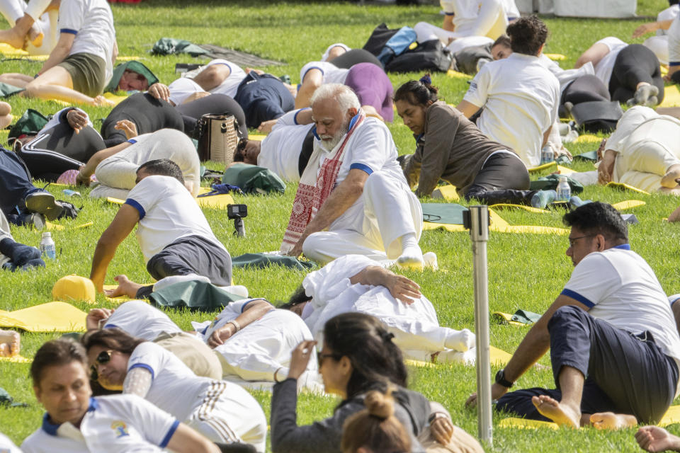 India Prime Minister Narendra Modi, center, practices yoga during the International Yoga day event at United Nations headquarters in New York on Wednesday, June 21, 2023. Modi has joined diplomats and dignitaries at the United Nations for a morning session of yoga, praising it as “truly universal” and “a way of life.” Modi kicked off the public portion of his U.S. visit at an event honoring the International Day of Yoga. (AP Photo/Jeenah Moon)