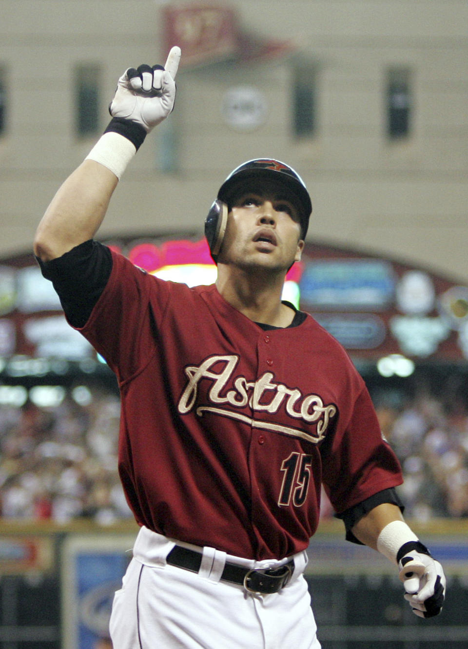 FILE - In this Oct. 17, 2004, file photo, then-Houston Astros' Carlos Beltran reacts after hitting a home run in the seventh inning against the St. Louis Cardinals during Game 4 of the National League Championship Series in Houston. Beltran is out as manager of the New York Mets. The team announced the move Thursday, Jan. 16, 2020. (AP Photo/David J. Phillip, File)