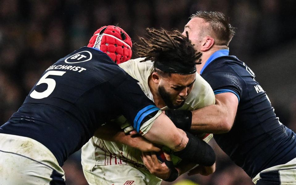 Lewis Ludlam is tackled by Scotland lock Grant Gilchrist - Glyn Kirk/AFP