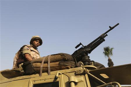 A soldier secures a road during the presidential elections in Cairo May 26, 2014. REUTERS/Mohamed Abd El Ghany