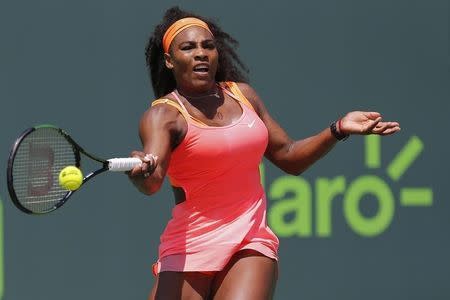 Mar 30, 2015; Key Biscayne, FL, USA; Serena Williams hits a forehand against Svetlana Kuznetsova (not pictured) on day eight of the Miami Open at Crandon Park Tennis Center. Williams won 6-2, 6-3. Mandatory Credit: Geoff Burke-USA TODAY