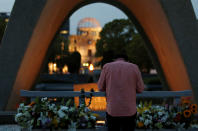 <p>A man prays in front of the cenotaph for the victims of the 1945 atomic bombing, at Peace Memorial Park in Hiroshima, Japan May 26, 2016 a day before President Barack Obama and Japanese Prime Minister Shinzo Abe arrive in the city. (Photo: Toru Hanai/Reuters) </p>