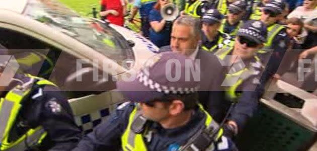 Treasurer Joe Hockey caught up in wild student protest in Melbourne's CBD. Photo: 7News