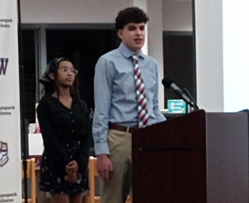 Two Wallenpaupack Area High School students, Ty Lounsbury, left, and Joshua Katz, right, did a presentation before the school board on Feb. 12, 2024, about the district's Leadership & Diversity Committee.